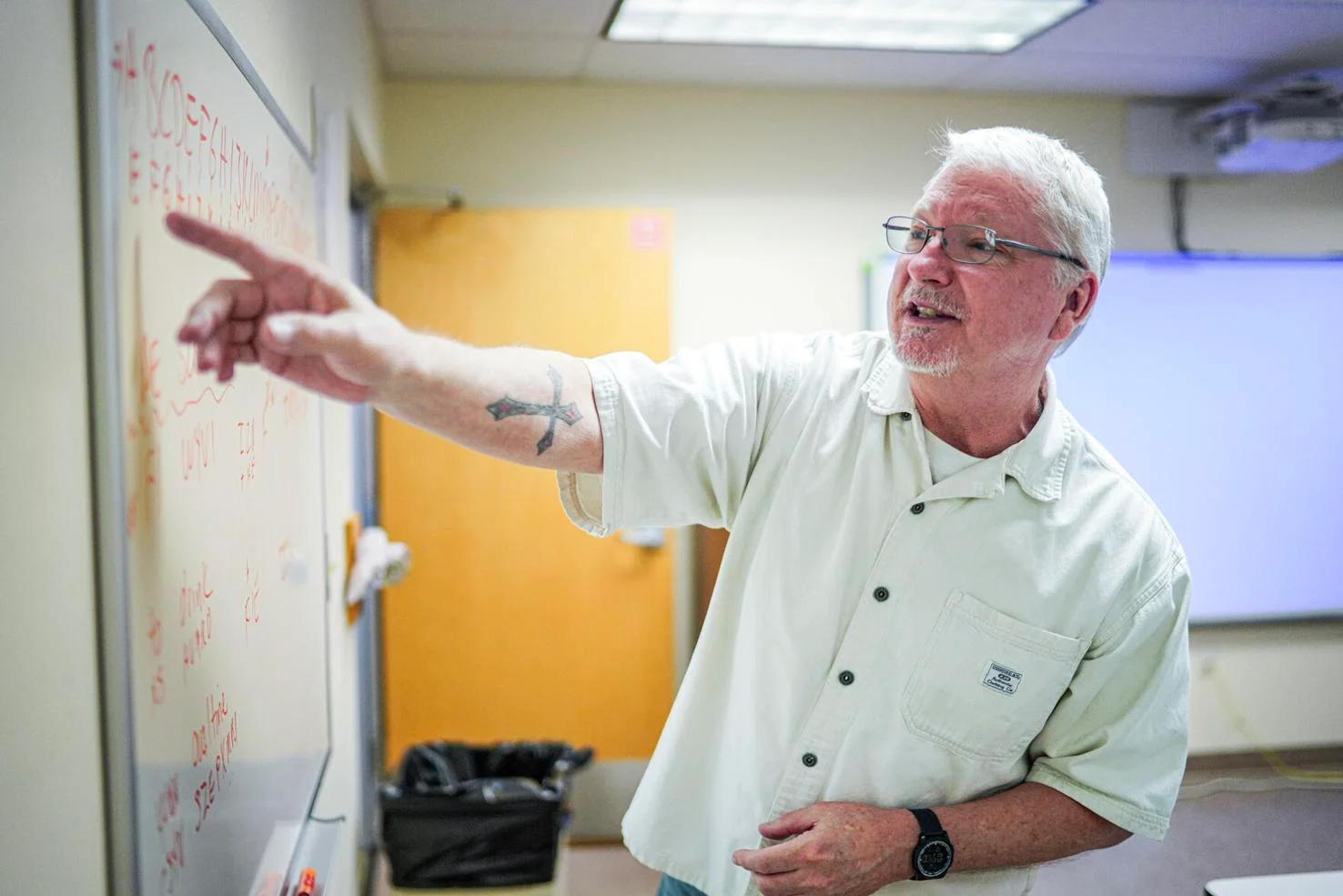 Michael Gideon explains the day's lesson — encrypting and deciphering a message manually — in his advanced topics in cybersecurity class last week at Northern New Mexico College in Española.